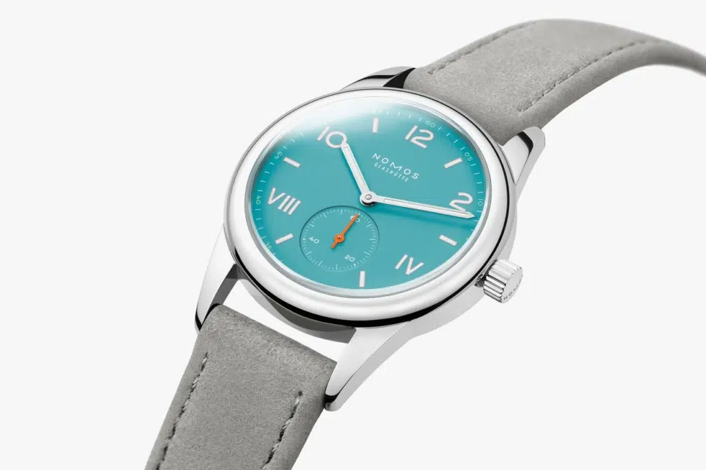Turquoise watch with gray strap.