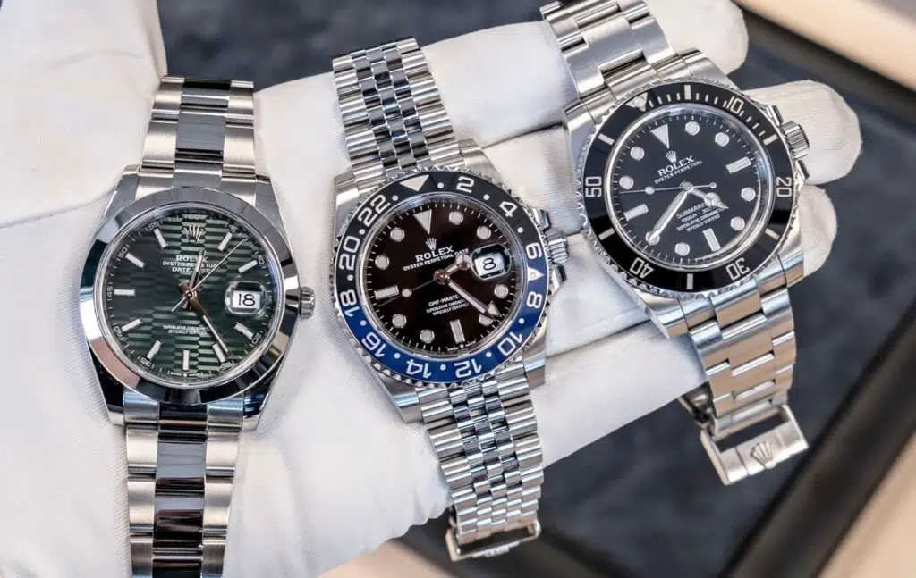 a group of watches on a hand