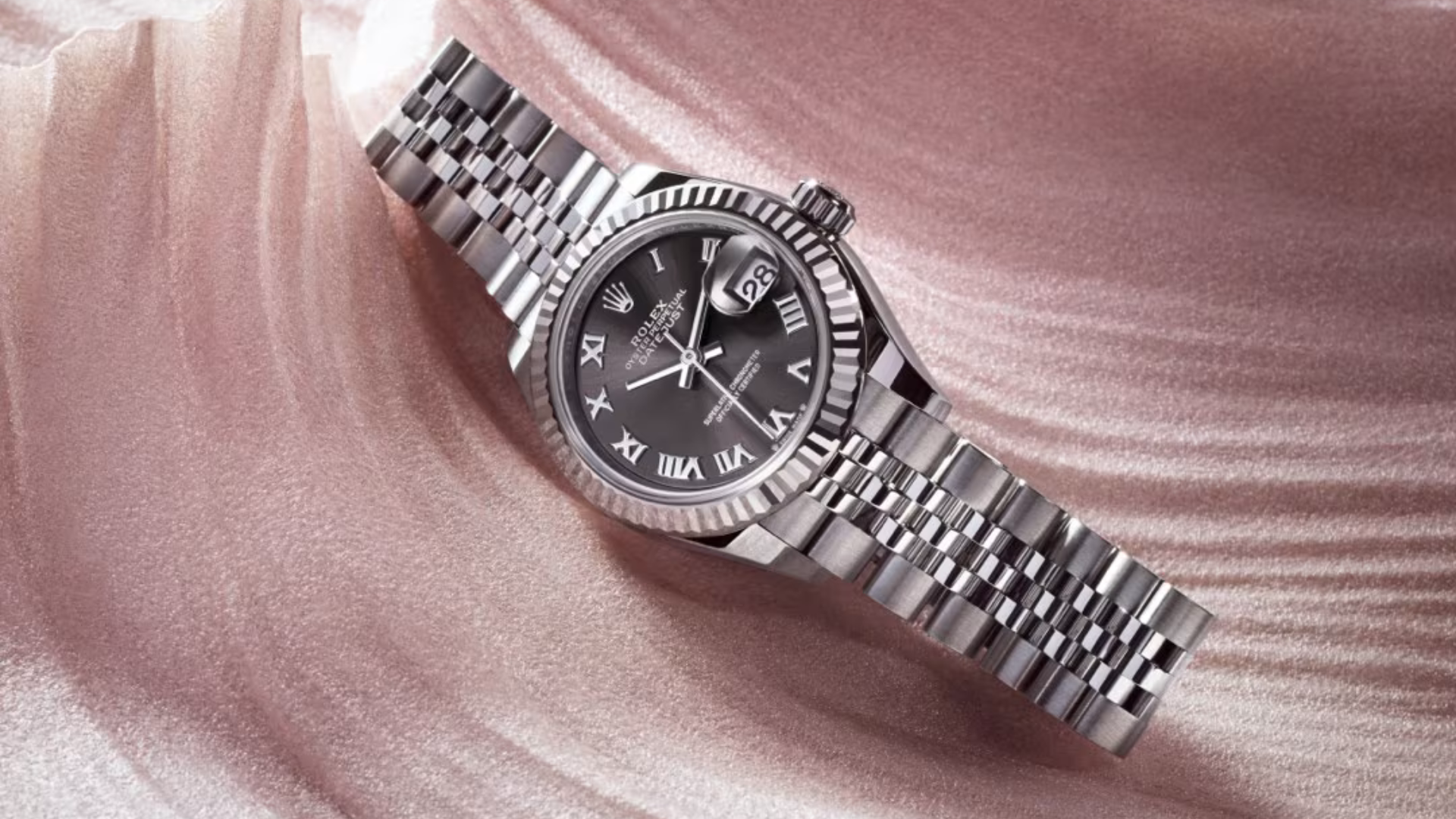 Lady Datejust on a Pink Background Rolex DateJust 28mm