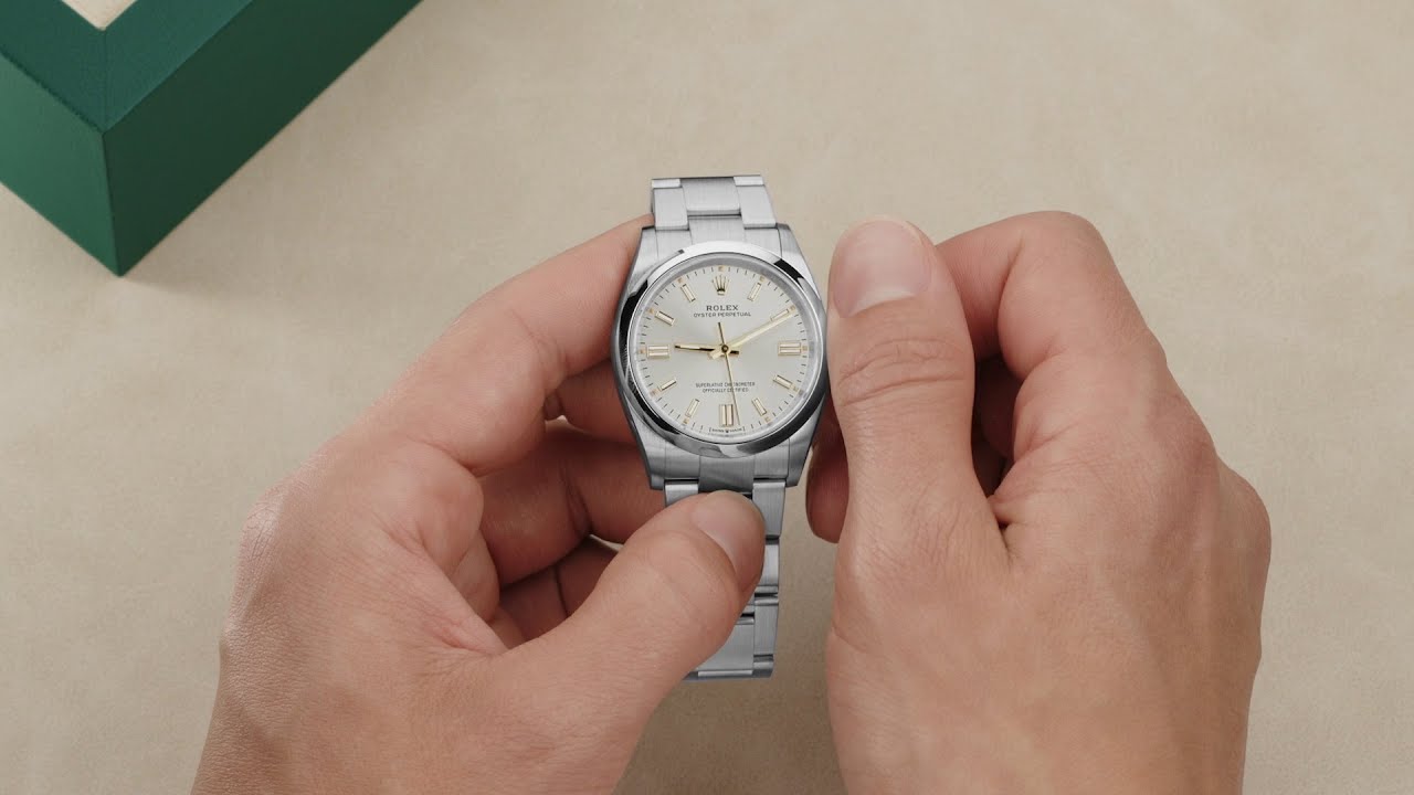 person turning the crown to set the date on a rolex oyster perpetual