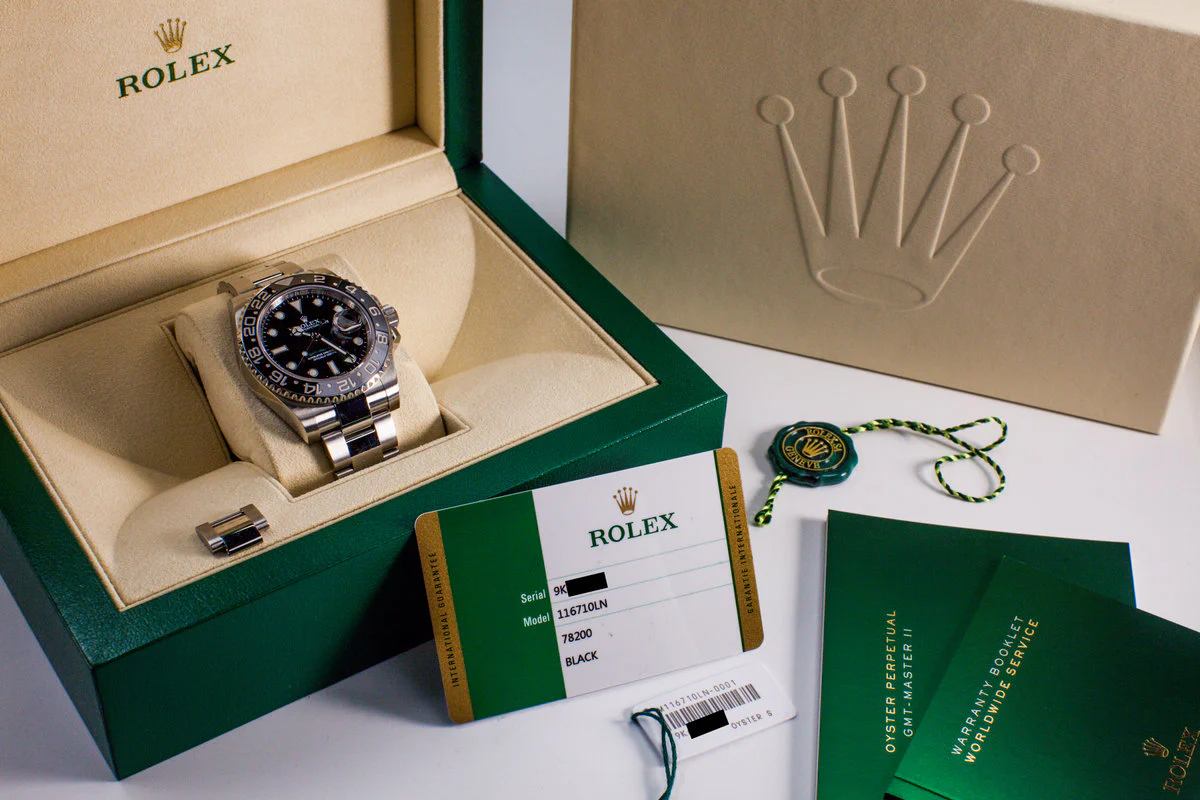 Rolex receipt, warranty card, and service records