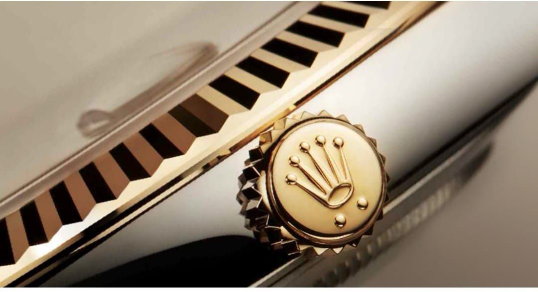 close up of the rolex crown logo on a watch close up of the rolex crown logo on a watch